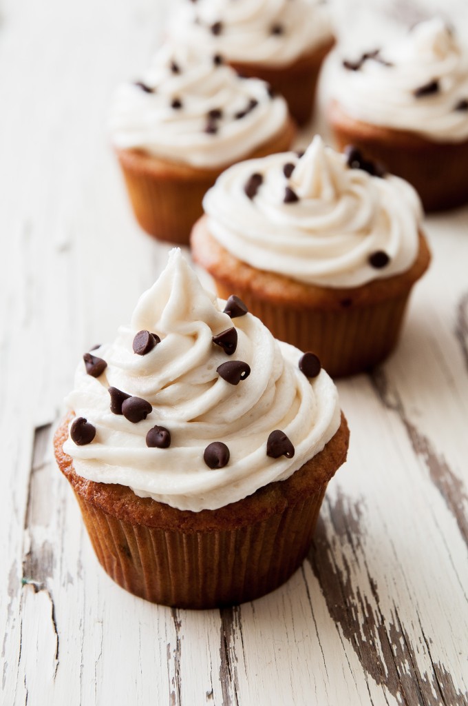 Take those ripe bananas and make Banana Chocolate Chip Cupcakes. They're moist, sweet, and the frosting is to die for! | ibakeheshoots.com